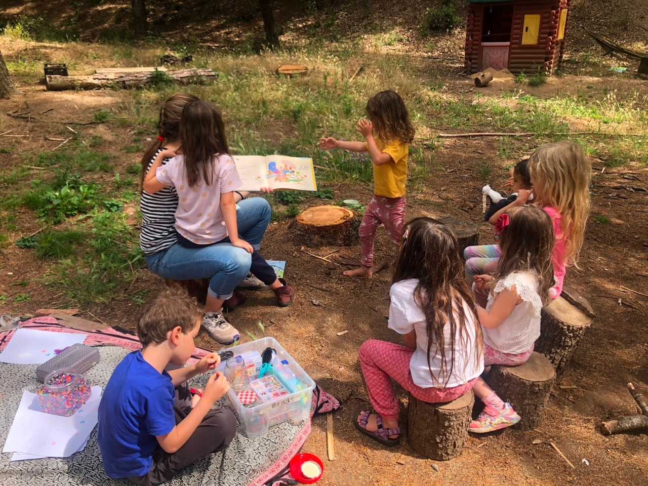 Small group learning together outdoors
